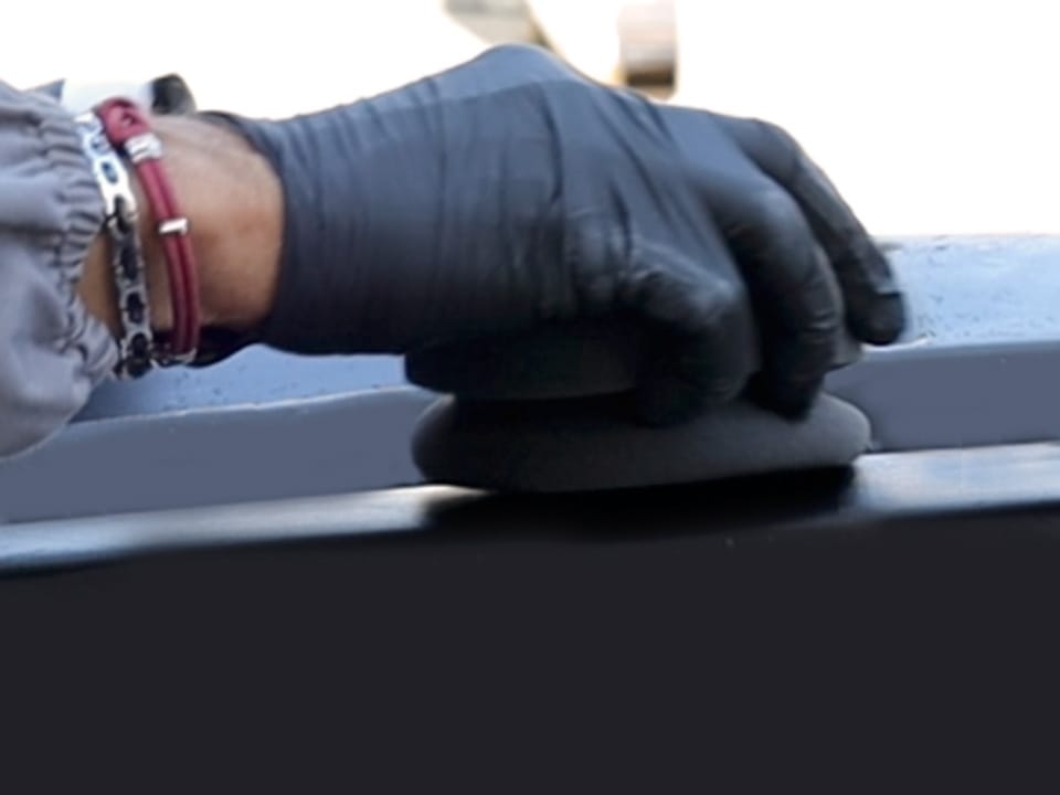 The Care Plastic Restorer is applied in circular motions on the car's plastic surfaces